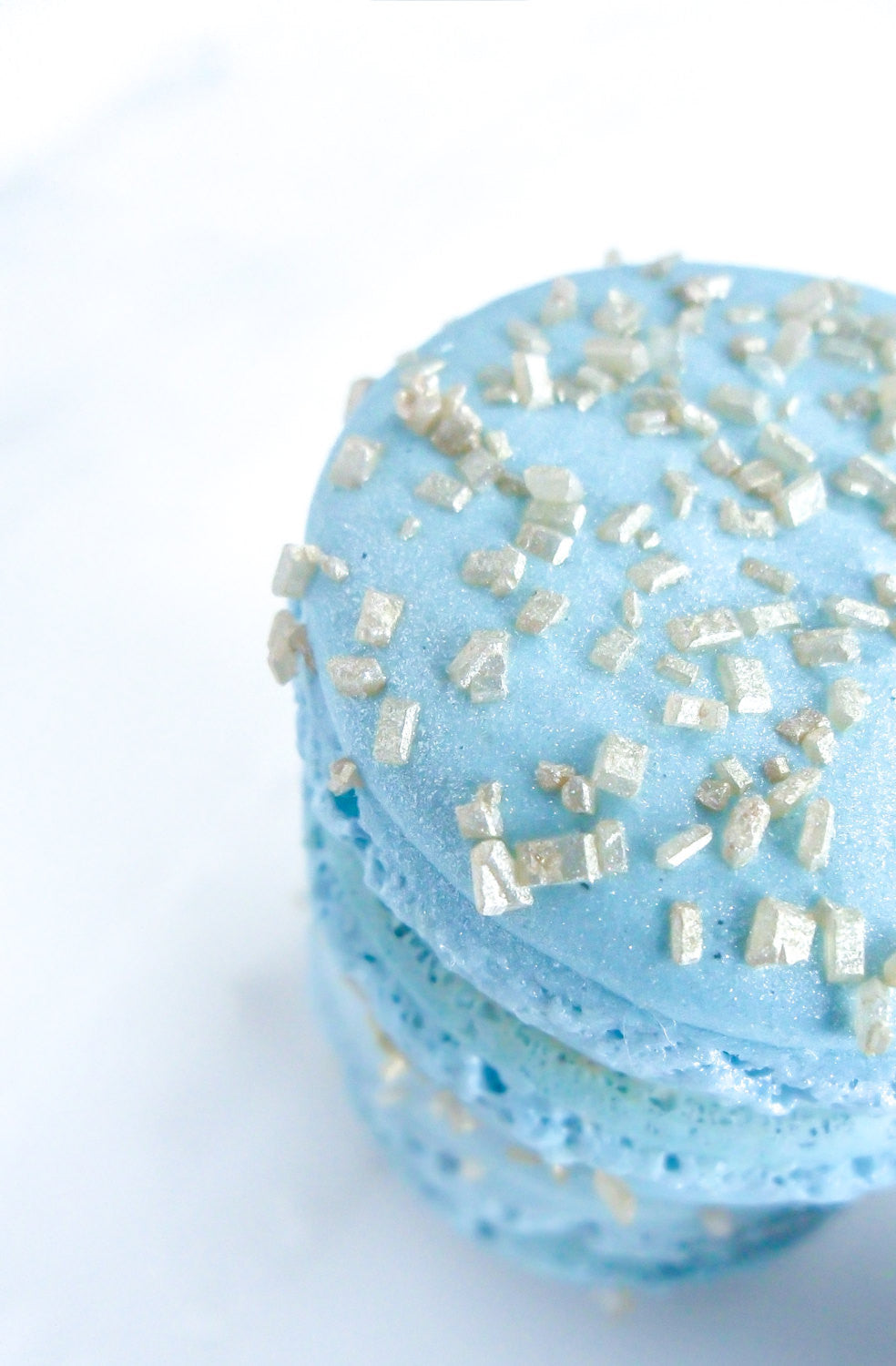 Elegant Baby Blue French Macarons With Gold Glitter Sugar Crystals & Madagascar Vanilla Ganache TheIcedSugarCookie.com Splendid Sweet Shoppe