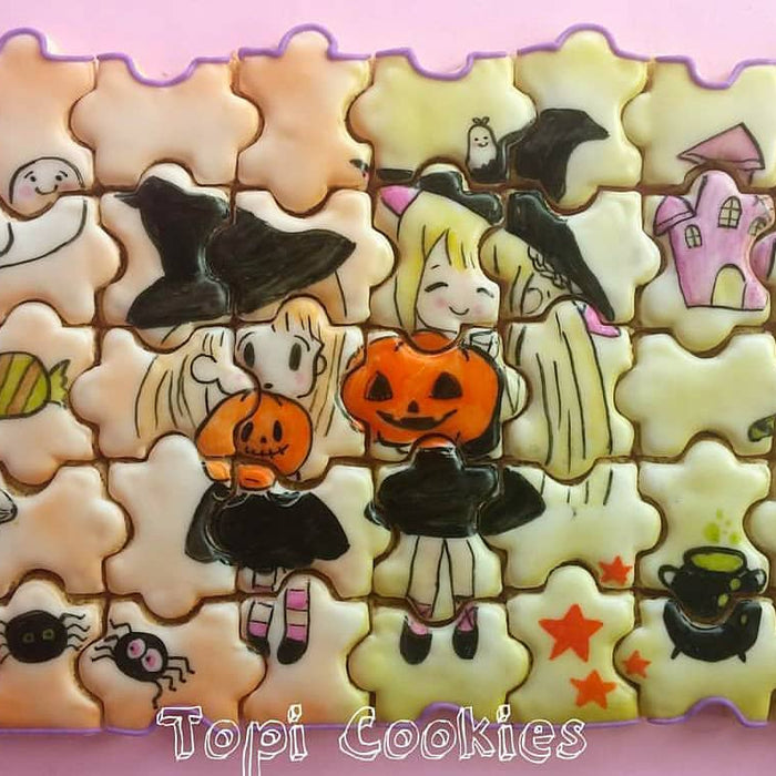 Halloween Cookie Puzzle created by @TopiCookies was featured on TheIcedSugarCookie.com #halloweencookies #halloweensugarcookies #halloween #cookies #sugarcookies #decoratedsugarcookies