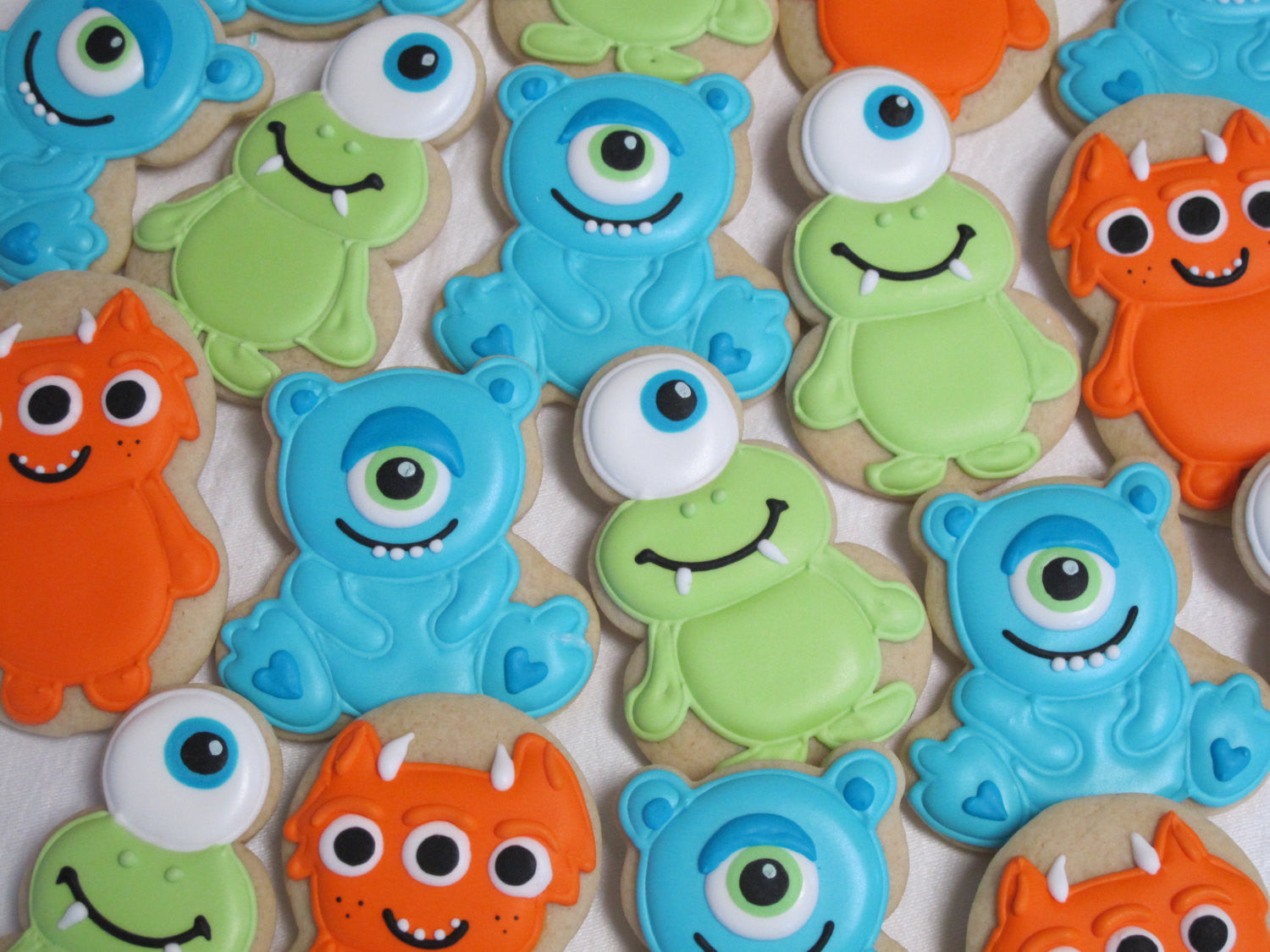 Little Monster Sugar Cookies-Monster Inc Birthday Party Cookies-Alien Cookies. TheIcedSugarCookie.com Marta Ingros