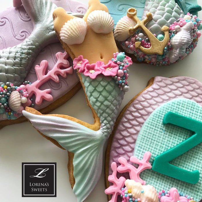Mermaid Baby Shower Fondant Cookies by @lorenarodriguezsaenz featured on TheIcedSugarCookie.com #mermaidcookies #mermaidparty #mermaids #mermaidbirthday #mermaidbirthdayparty #theicedsugarcookie