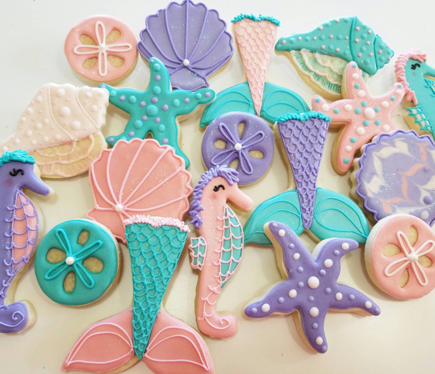 Under The Sea Birthday Party Cookies-Sand Dollar, Mermaid Tails, Conch Shells, Starfish. TheIcedSugarCookie.com Kessa Cakes