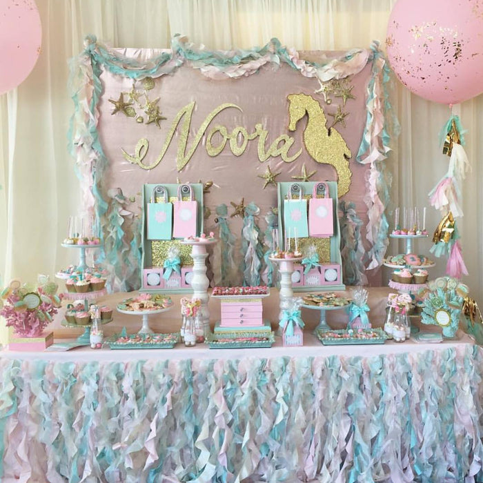 Pink, Aqua & Gold Mermaid Number One Birthday Party featured on TheIcedSugarCookie.com Desserts by @ronisugarcreations Party Planner was by Liza Naguib #mermaidparty #mermaidbirthday #mermaidbirthdayparty #mermaidpartyideas #theicedsugarcookie