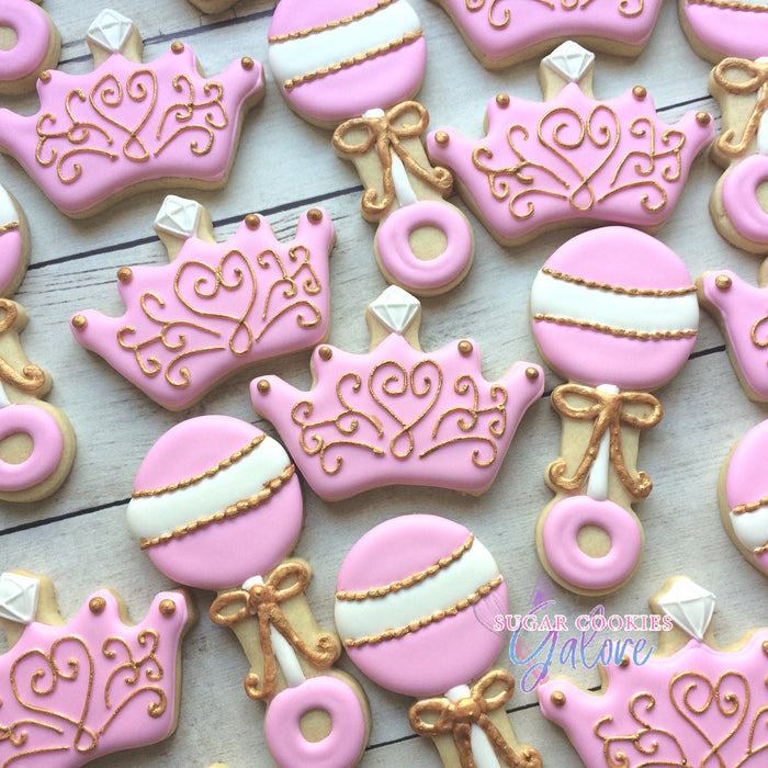 Pink And Gold Princess Baby Shower Iced Sugar Cookies by Sugar Cookies Galore Featured on TheIcedSugarCookie.com #cookies #sugarcookies #decoratedcookies #babyshowercookies #babyshower #princesscookies #babyshowerparty