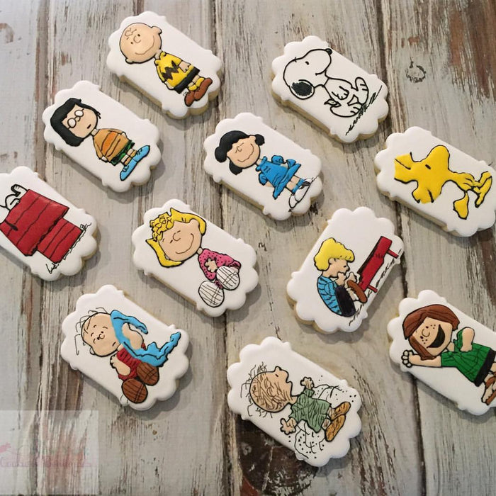 Snoopy Charlie Brown Peanuts Iced Sugar Cookies by @thenewyorkcookieboutique on TheIcedSugarCookie.com #snoopycookies #charliebrowncookies #sugarcookies #cookies #theicedsugarcookie