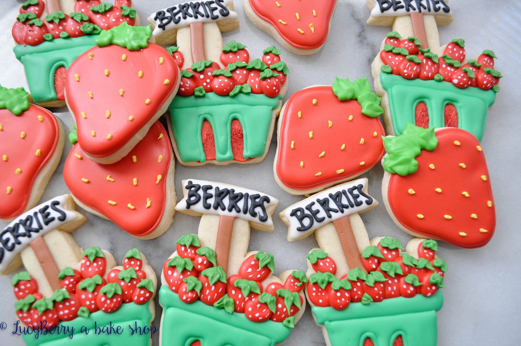 Strawberry "Berry Patch" Iced Sugar Cookies created by "LucyBerry A Bake Shop" featured on TheIcedSugarCookie.com #cookies #sugarcookies #decoratedcookies #theicedsugarcookie #icedsugarcookies #strawberrycookies #strawberryparty #berryparty