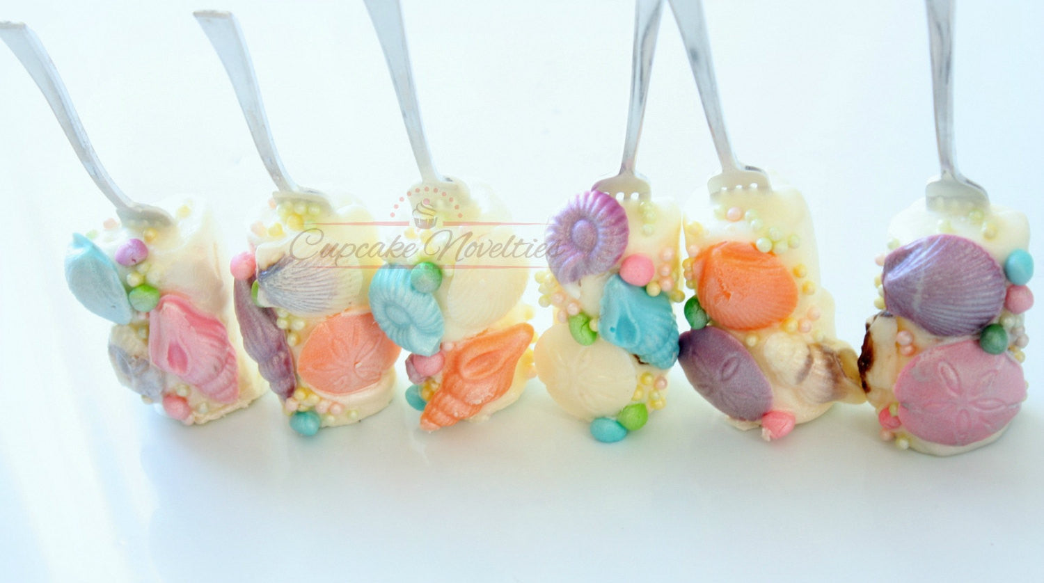 Dinglehopper Mashmallow Pops-The Little Mermaid Birthday Party Food. TheIcedSugarCookie.com Cupcake Novelties