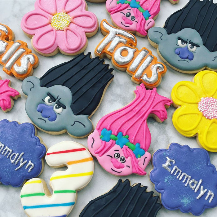 Trolls Birthday Party Iced Sugar Cookies made by "Peace Love & Cookies" featured on TheIcedSugarCookie.com #cookies #trollscookies #trollcookies #sugarcookies #trollsparty #trollspartyideas #trollsbirthdayparty #trollsbirthday #theicedsugarcookie #decorat