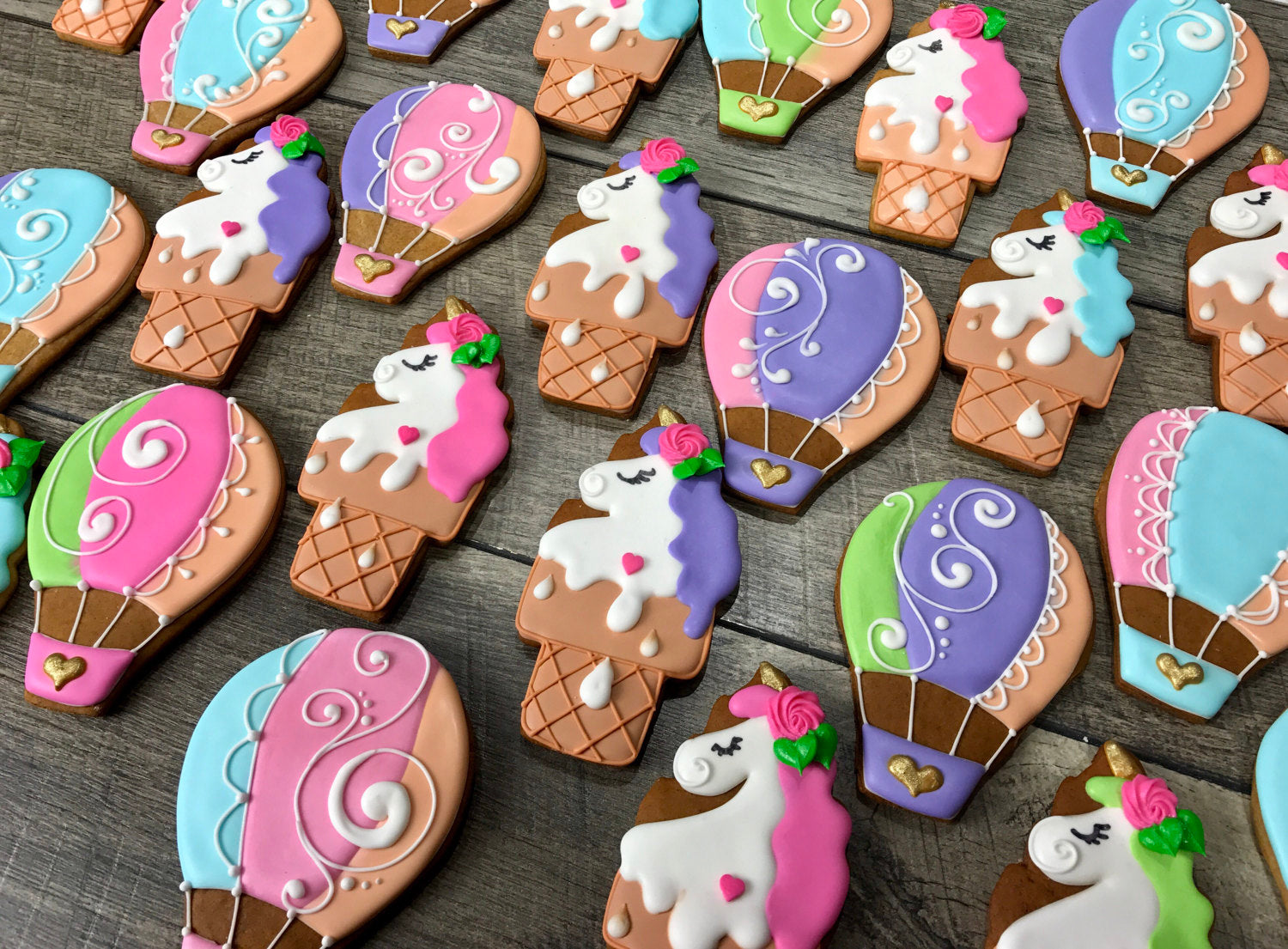 Unicorns And Hot Air Balloons Iced Sugar Cookies created by Tale Cookies featured on TheIcedSugarCookie.com #cookies #sugarcookies #decoratedcookies #unicorncookies #hotairballooncookies #theicedsugarcookie