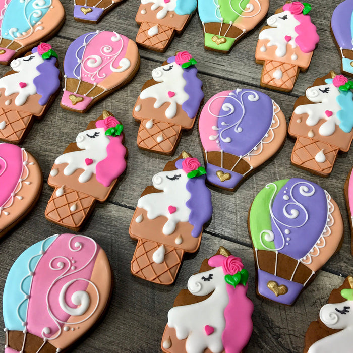 Unicorns And Hot Air Balloons Iced Sugar Cookies created by Tale Cookies featured on TheIcedSugarCookie.com #cookies #sugarcookies #decoratedcookies #unicorncookies #hotairballooncookies #theicedsugarcookie