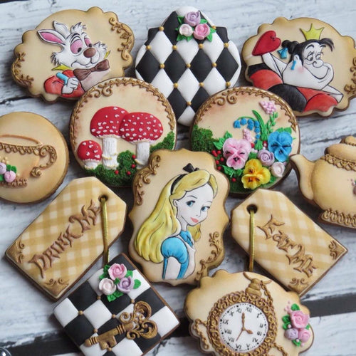 Alice In Wonderland Iced Sugar Cookies featured on TheIcedSugarCookie.com Created by @maybeacookie #cookies #sugarcookies #aliceinwonderlandcookies #theicedsugarcookie