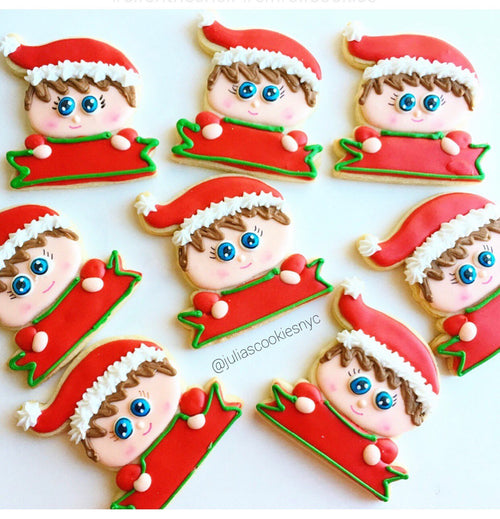 Christmas Elf Iced Sugar Cookies by Julia Perugini from "Cookies By Julia" featured on TheIcedSugarCookie.com #elfcookies #elfsugarcookies #elf #sugarcookies #decoratedsugarcookies #christmascookies #christmas #theicedsugarcookie