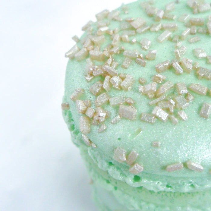 Elegant Mint Green French Macarons Encrusted With Gold Sugar Cyrstals & Madagascar Vanilla Ganache. TheIcedSugarCookie.com Splendid Sweet Shoppe